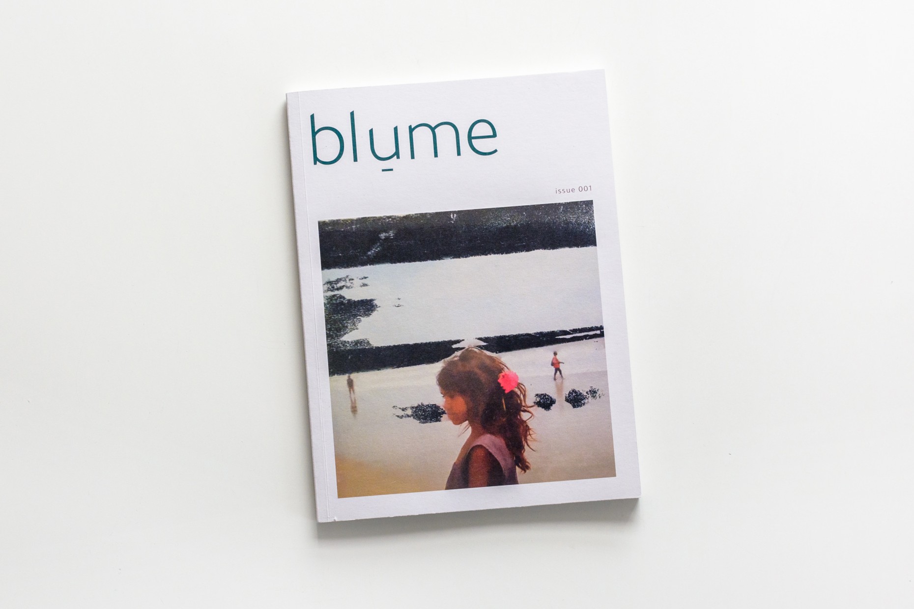 A product image showing the cover of Issue 001 of blume magazine